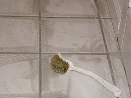 Detail scrub-brush work on dirty grout lines for a thorough M-M Cleaning result