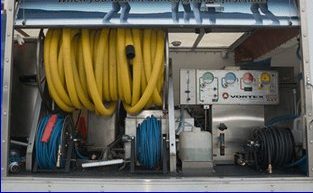 Truck-mounted hot water extraction system used by M-M Cleaning Service in Bloomington-Normal IL